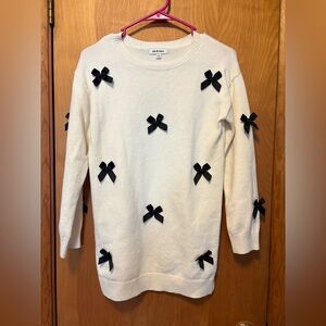 Chic Cream Dress with Black Bow Details